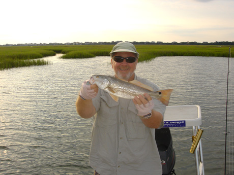 capt-rick-with-a-topwater-red.jpg