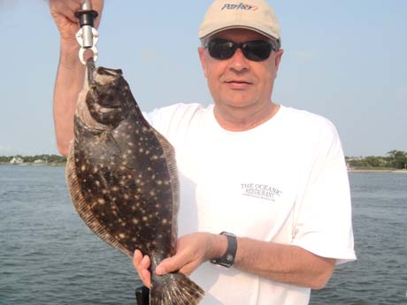 Glenn-with-First-Flounder-July-5-2011